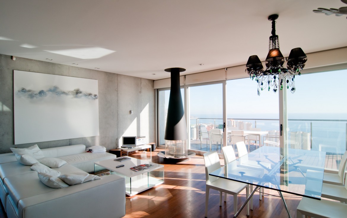 A living room with an exit onto the terrace.